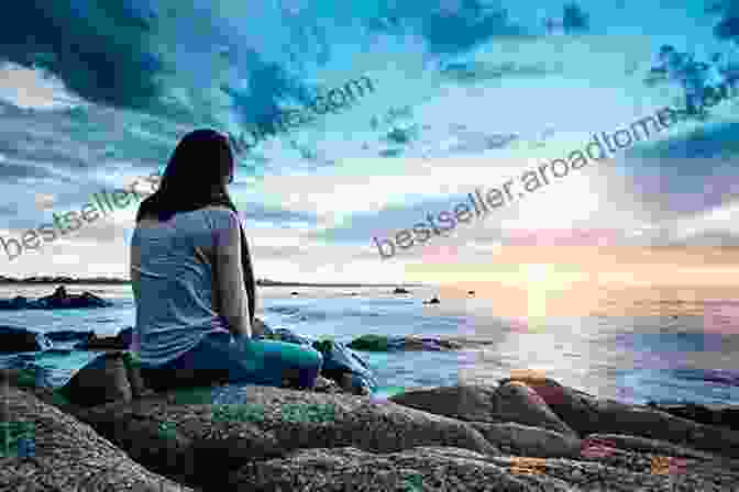 A Young Woman Sitting On A Rock Overlooking The Ocean O Is For Ocean Ashley Marie Mireles