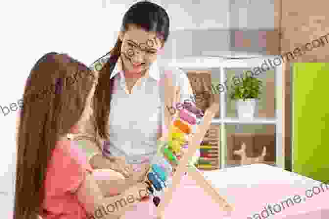 Occupational Therapist Demonstrating A Therapeutic Technique The Essential Guide For Newly Qualified Occupational Therapists: Transition To Practice